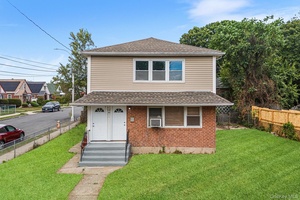 Welcome to 172 04 Amelia Rd, a classic two family home offering versatility and opportunity in Jamaica, NY.