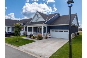 Gorgeous sought after bungalow style home on the 16th hole overlooking the fairway and green of a championship golf course.