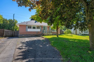 Huge Lot on a Sleepy Street with In Law Potential !