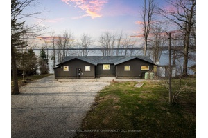 Welcome To This Fully Renovated 3 Bedroom Bungalow Offering 1, 361 Sq Ft Of Bright, Modern Living Space On A Large Lot With 123 Ft Of Prime Waterfront On Lake ...