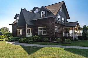 Lake Ontario Log Cabin Retreat Nestled on the picturesque shores of Lake Ontario, this stunning log cabin combines rustic elegance with luxurious comfort, offering over 3, 500 sq.