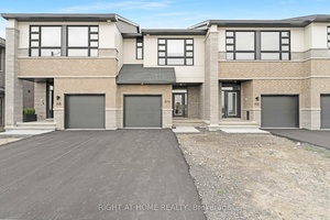 Welcome to 974 Acoustic Way, a stunning executive townhome nestled in the highly sought after Riverside South community.