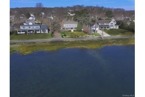 Waterfront Colonial Retreat Discover timeless charm in this lovely historic colonial nestled along Bayville s serene waterfront.
