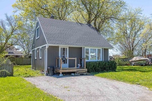 Lovely 1. 5 storey home features open concept living with large living area, nice working kitchen main floor bedroom and full bath.