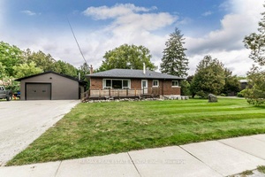 Gorgeous upgraded open concept brick bungalow with a huge garage workshop on half an acre in picturesque village of Eden Mills.