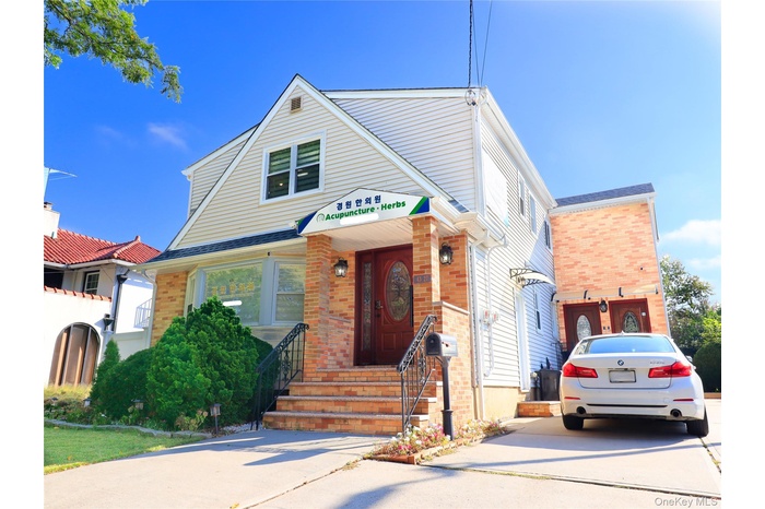 View of front of house featuring brick siding