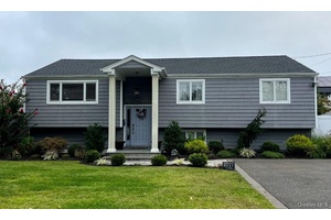 Welcome to this beautifully updated generously sized 4 bedroom, 2 bath high ranch, perfectly combining modern comfort and timeless design.