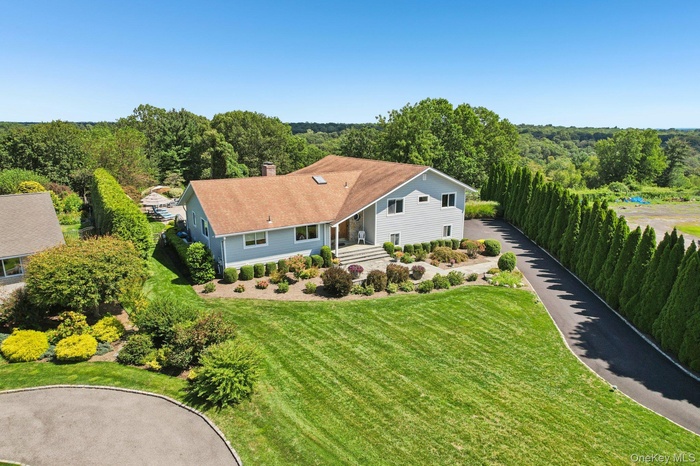 Welcome home to this stunning 4700+ Square foot Split in award winning Blind Brook school district