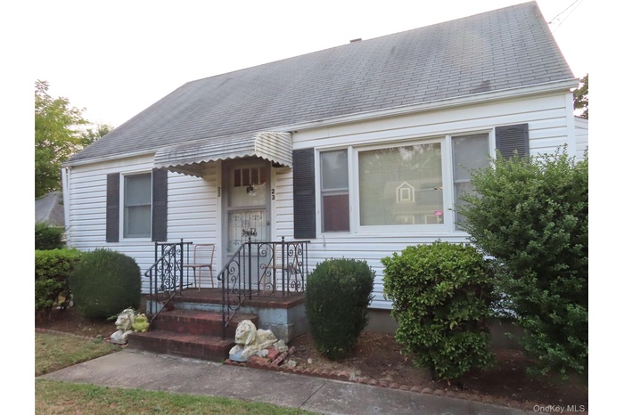 View of front of property featuring a shingled roof