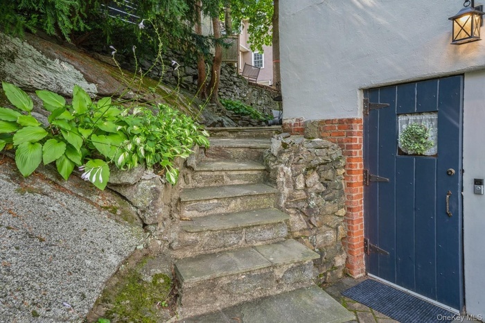 Property entrance on the left side of the house