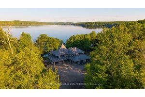 Set on just under six acres on Boshkung Lake in the heart of the Haliburton Highlands, this private estate blends luxury waterfront living with timeless natural beauty.