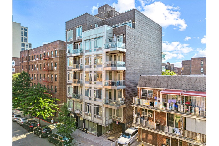 View of apartment building / complex featuring a city view
