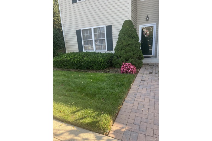 Property entrance with a lawn