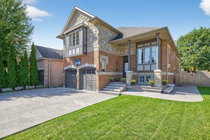 Not to be missed raised bungalow with 2 primary bedrooms with ensuite baths, perfect for multi family living.