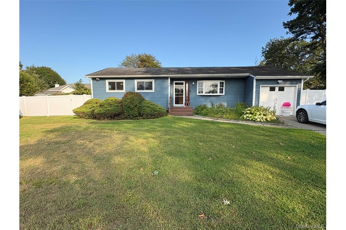 Single story home featuring a garage