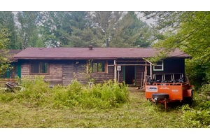 A rare opportunity to own a private waterfront retreat with endless potential.