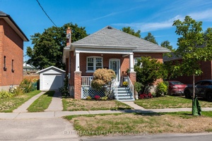 This lovingly maintained 2 bedroom brick bungalow is the perfect blend of comfort, convenience, and character.