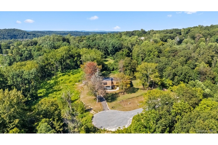 Drone / aerial view of a heavily wooded area
