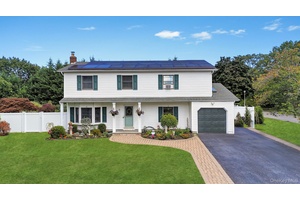 Your search is over ! This magnificent Colonial is set in a lovely neighborhood within the Comsewogue School District, situated on over a half acre of picture perfect grounds.