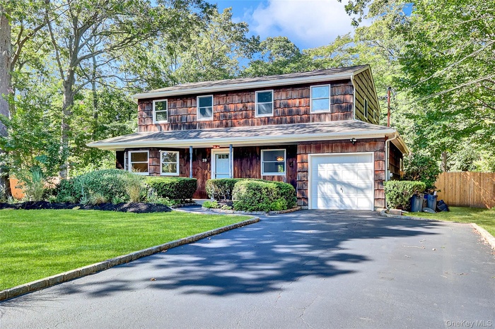 Front of home with 9 car driveway