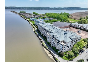 In one word exquisite. Experience the ultimate in riverfront living at this stunning two bedroom, two bath condo located directly on the walkway to the Pier in the charming village ...