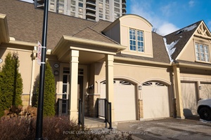 Elegant condo townhouse with a bright open concept design and vaulted Great Room leading to a spacious deck overlooking a private garden.