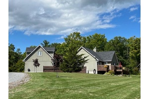 Picture perfect and perched on a hill with sweeping views of over 6 acres, this rare find is truly move in ready.