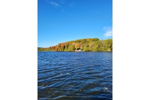 Grab a hot drink and relax on the covered front porch, soaking in the picturesque lakefront views and beautiful changing fall colours.