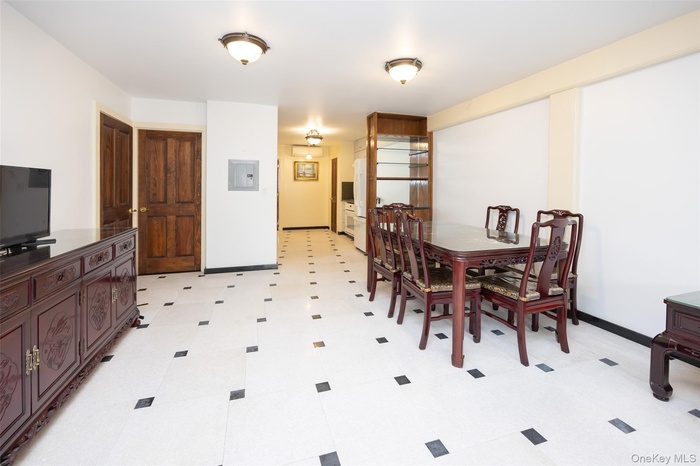 Dining room with baseboards and electric panel