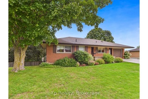 This well maintained brick bungalow is situated in a desirable neighbourhood, offering a private fenced yard with mature trees and a wooded backdrop.