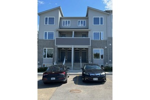 A recently constructed stacked townhouse is featuring three bedrooms and three bathrooms.
