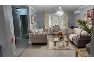 Discover a rare blend of modern elegance and suburban tranquility in this stunning two family residence nestled in the Pelham Parkway neighborhood of the Bronx.