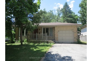 Spacious 3 2 bedroom backsplit home featuring 2 full bathrooms, 2 half bathrooms, and open concept kitchen.