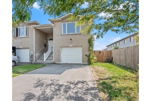 Welcome to this bright and deceivingly spacious 2 1 bedroom end unit home with a beautifully finished walk out basement.
