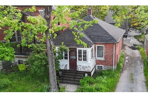 This solid brick bungalow is perfectly located just steps from Kingston's Memorial Centre and the beloved Farmers' Market.