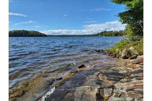 Experience the tranquility of lakeside living in this beautiful four bedroom bungalow.