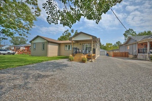 Welcome to 307 Riverside Drive, a spacious and sun filled bungalow offering over 1, 850 sq.