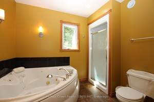 Set on 17 acres of mixed field and hardwood bush, this private country retreat is designed for a sustainable lifestyle.