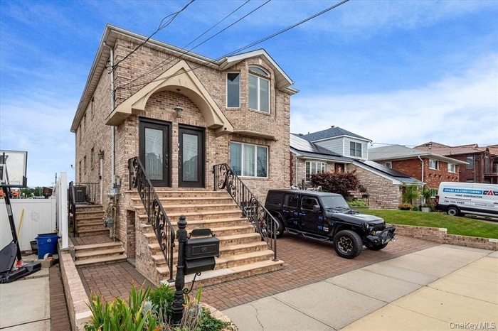 View of front of home with brick siding