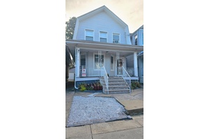 Welcome to 97 12 110th Street, a classic two story single family home that blends timeless charm with unbeatable convenience.