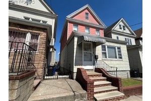 Maspeth completely detached legal 2 family frame home.