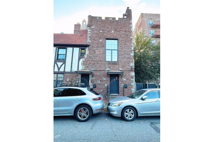 View of front of property with brick siding