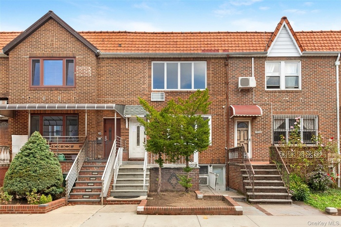 Traditional-style house featuring brick siding
