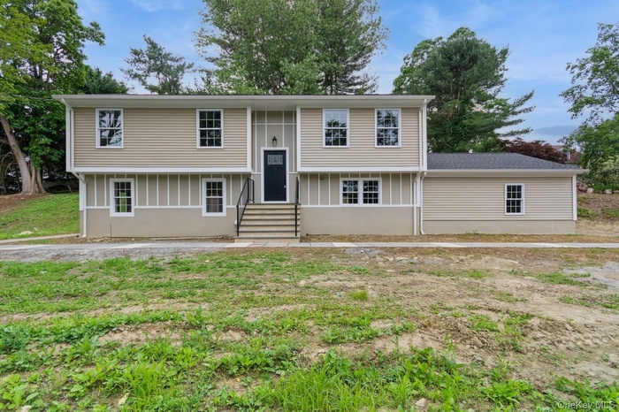 Bi-level home featuring entry steps