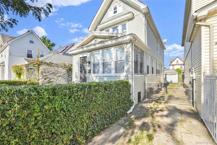 View of front of house with a gate