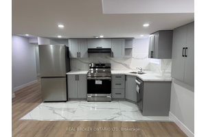 Bright and modern 2 bedroom basement unit with one full bathroom, spacious open concept living area, and side entrance for added privacy.