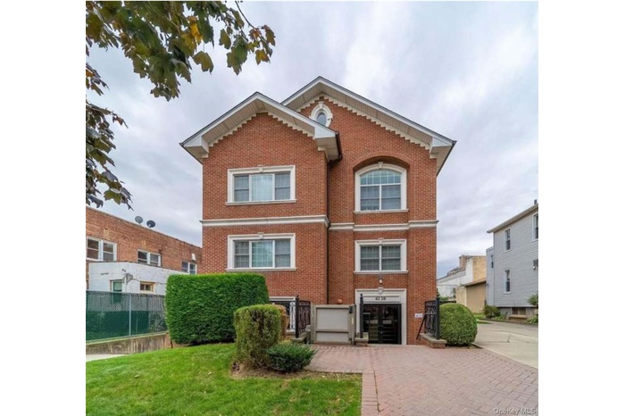 View of front of home featuring brick siding
