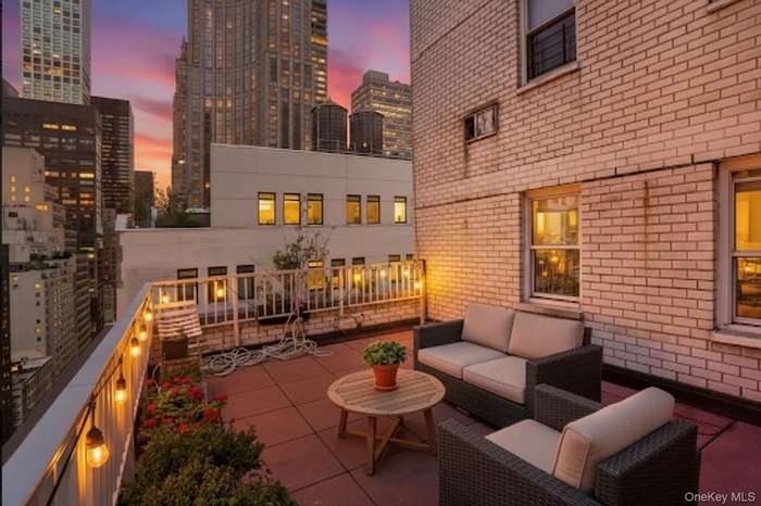 View of patio / terrace with an outdoor hangout area and a city view
