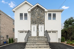 A touch of class best describes this HUGE meticulous brand new two family.