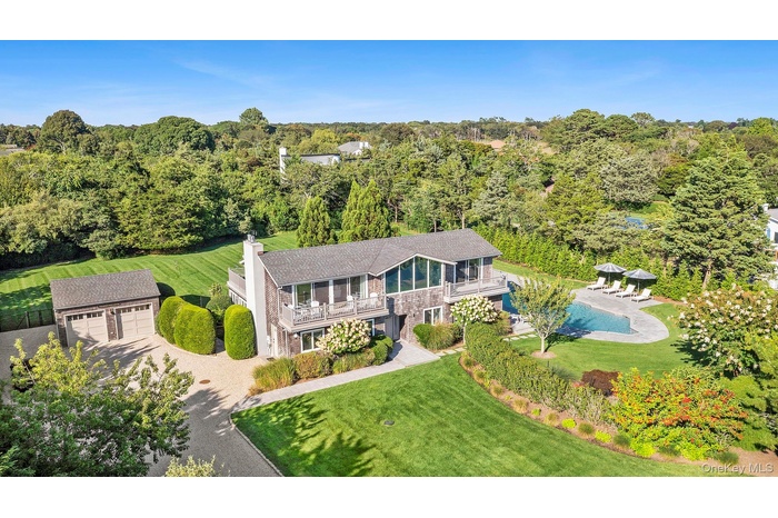 View from above of property with a heavily wooded area